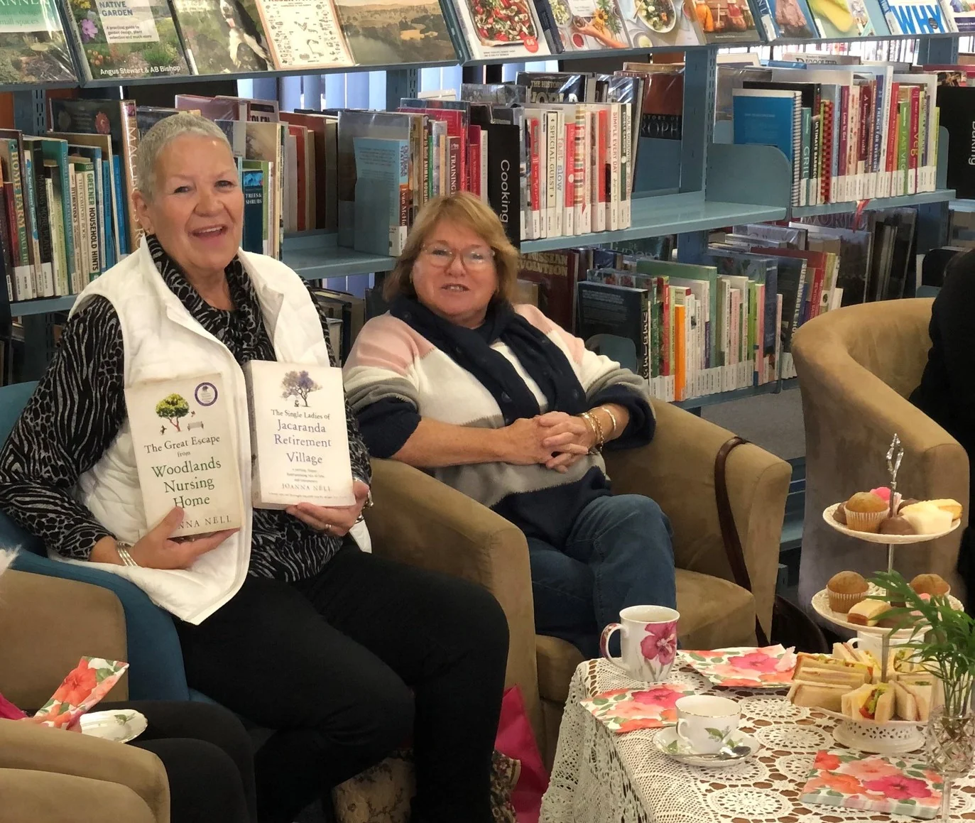 Woman sharing books she has read at high tea