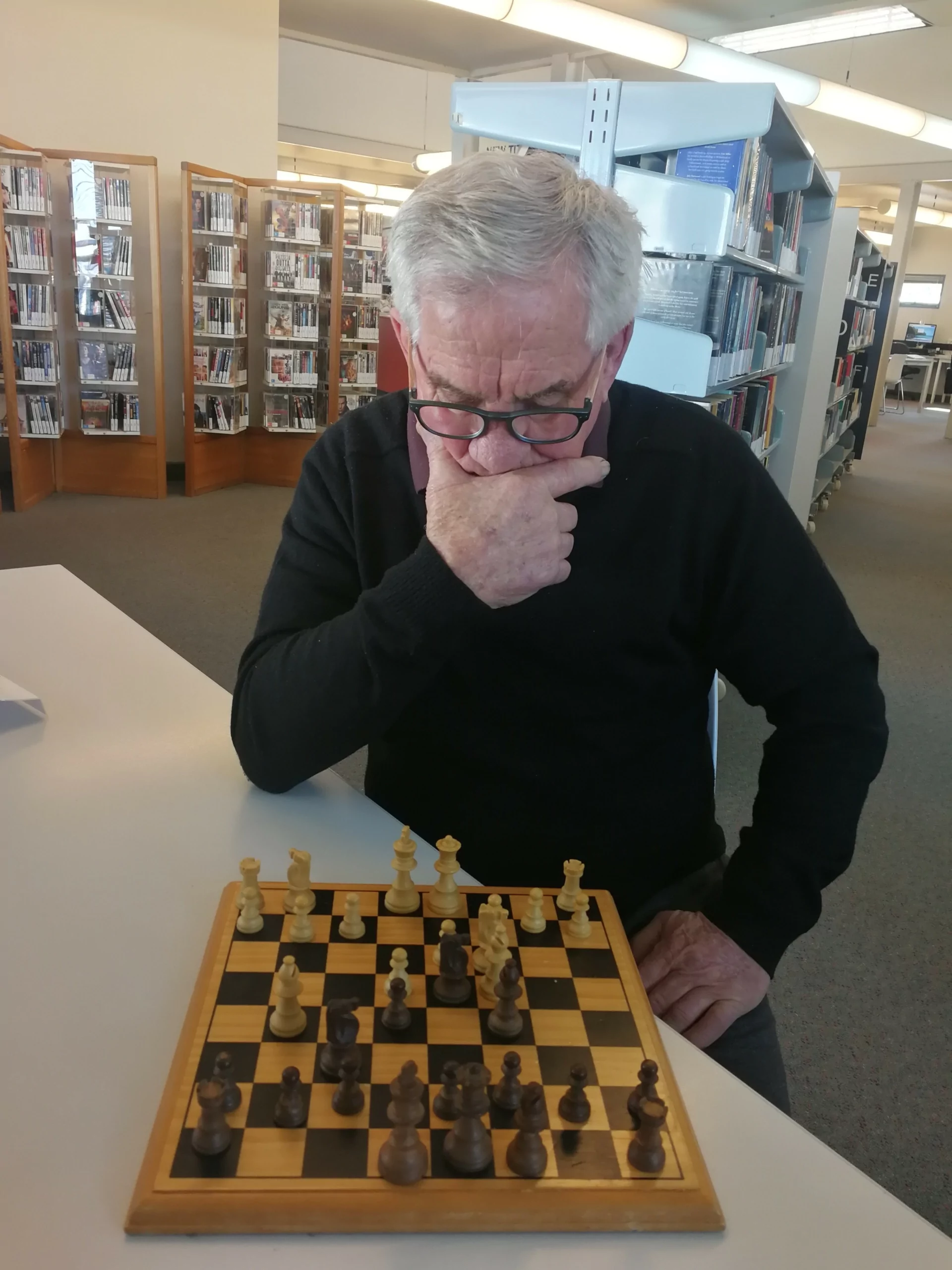 Man pondering next chess move