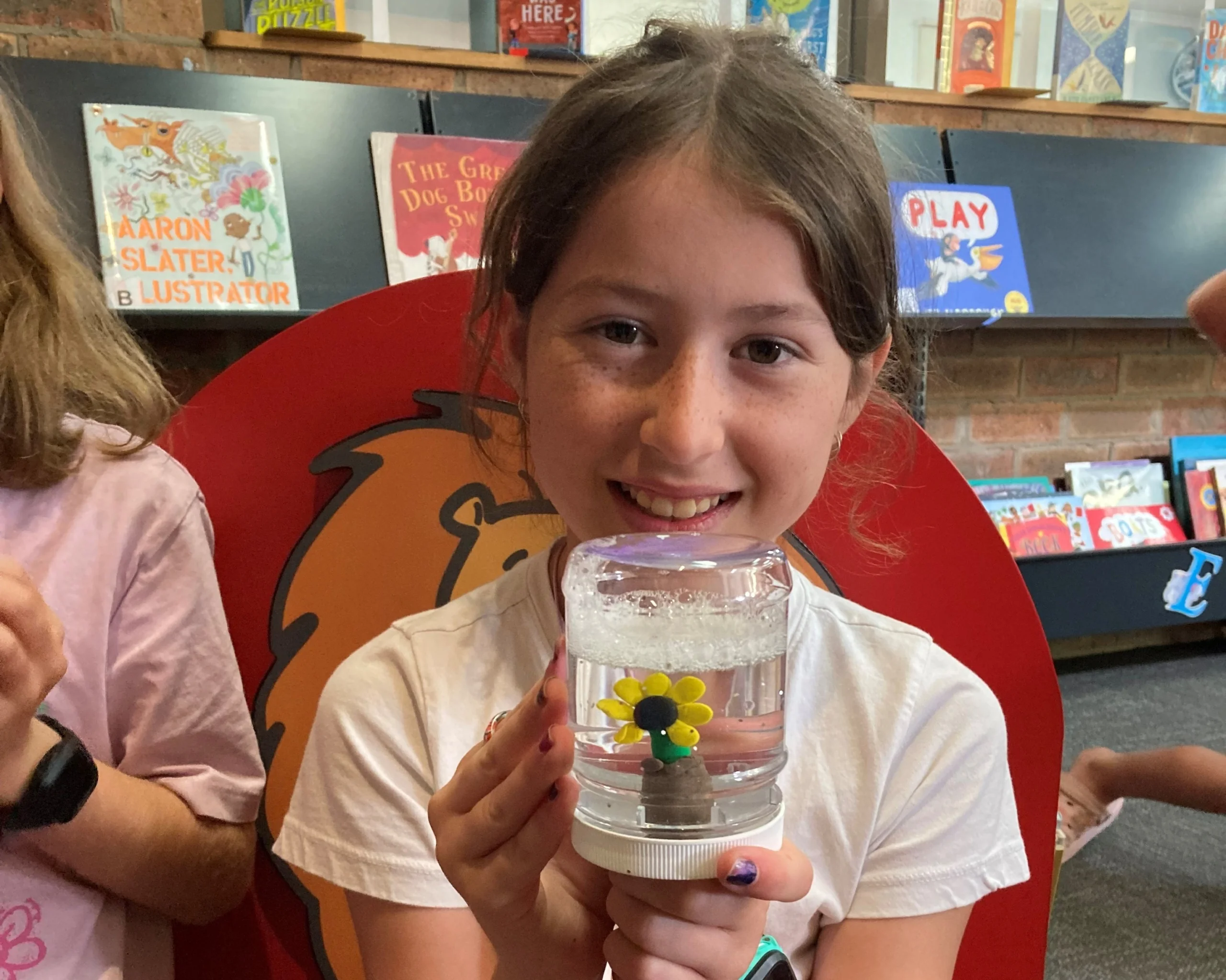 Child with her home made snowglobe