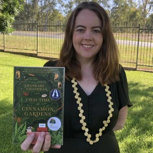 A library staff member displays Chai Time at Cinnamon Gardens