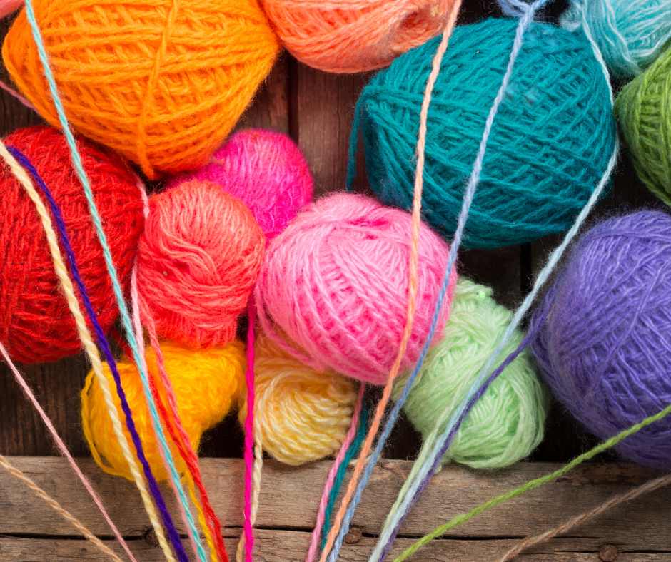 Image shows brightly coloured balls of wool