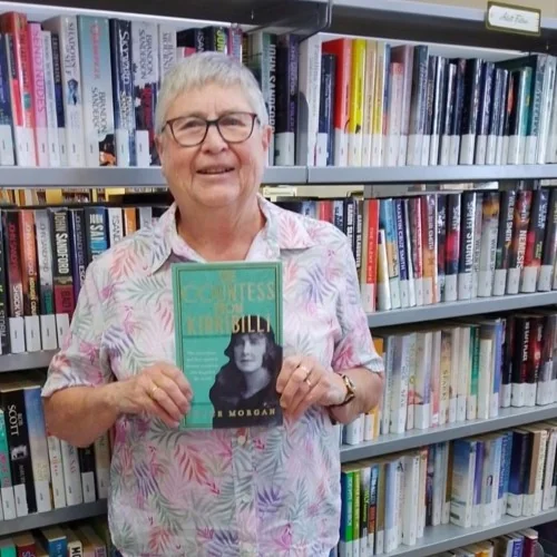 Pam Halliburton, RRL Advisory Committee Chair holds up The Countess from Kirribilli by Joyce Morgan