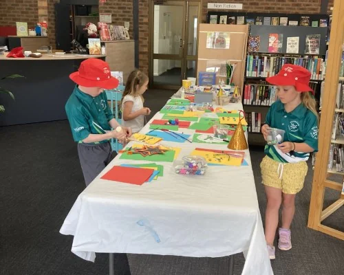 Kids doing Christmas craft at the library