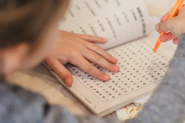 Image of a child doing a wordsearch